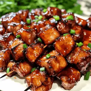 Fire up your grill for a taste of the Philippines with this Filipino BBQ Pork recipe! Juicy, marinated pork skewers are bursting with sweet and savory flavors thanks to a delightful blend of soy sauce, garlic, and brown sugar. Perfect for summer cookouts, family gatherings, or just a delicious weeknight dinner. Don't forget to save this recipe for your next BBQ feast!